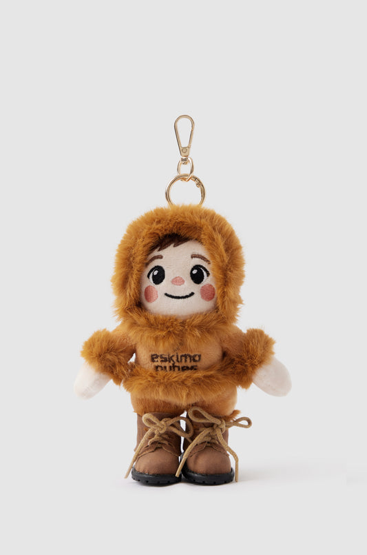 Eskimo Qubes plush doll key ring in a brown hooded outfit and lace-up boots on a light background.
